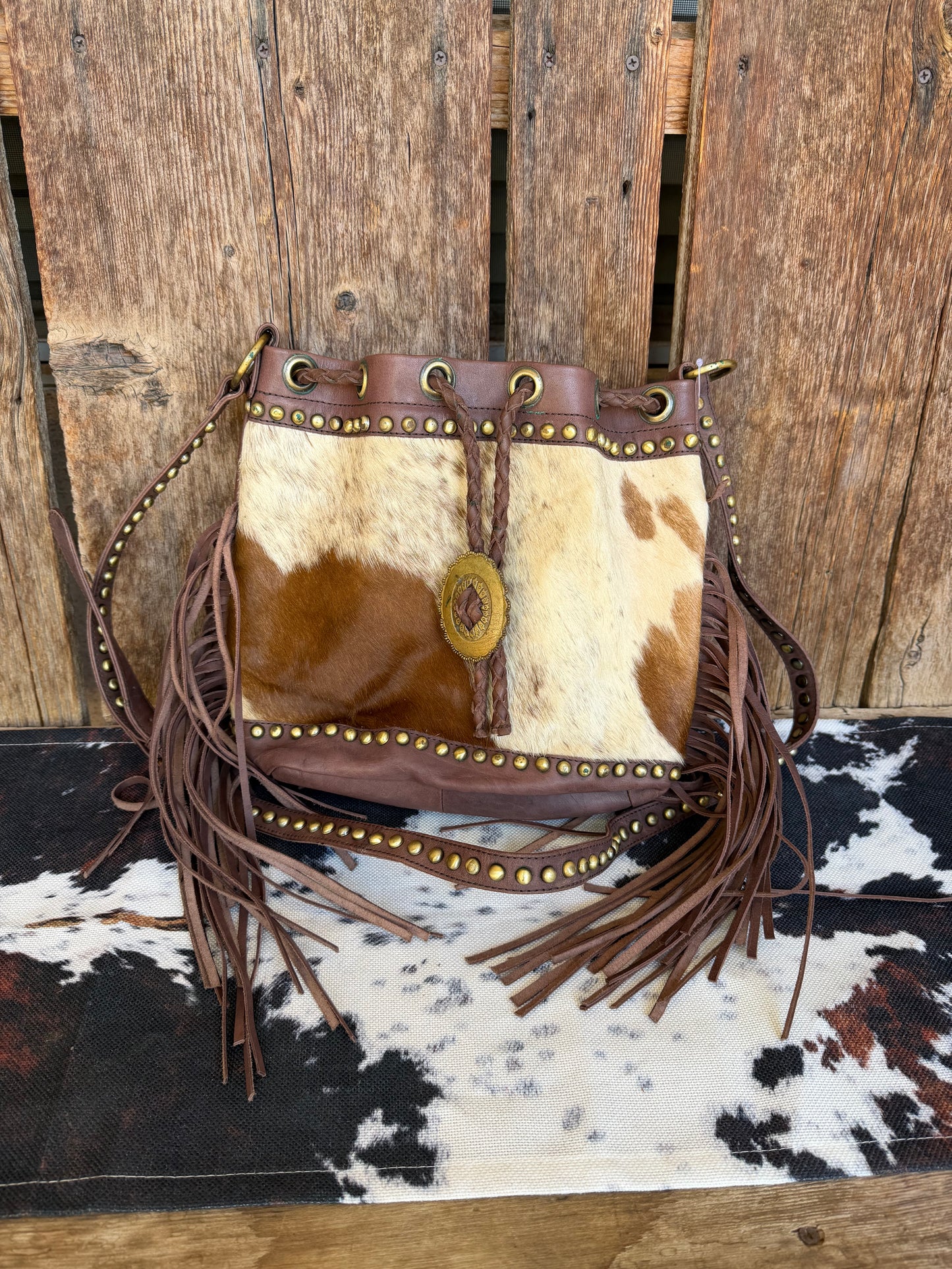 Fringe cowhide crossbody bucket bag